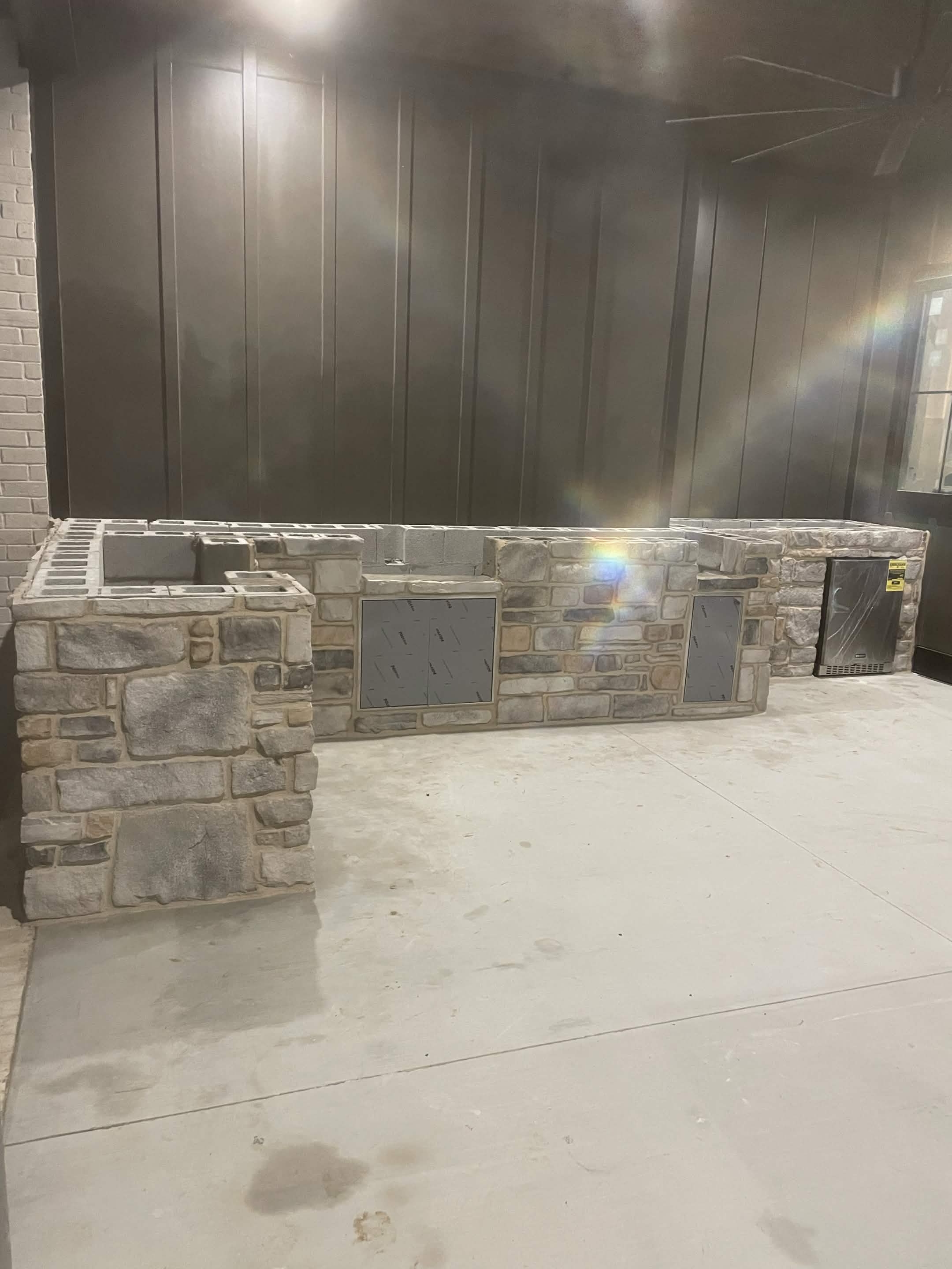 Custom stone outdoor bar and kitchen